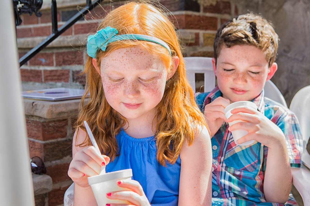Hire slush machine — brother and sister enjoying iced treats outdoors for parties and events in Johannesburg, Sandton and Randburg